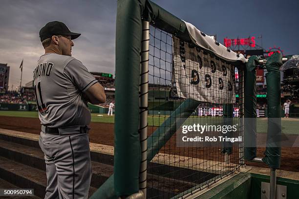 Manager Mike Redmond of the Miami Marlins looks on from the dugout during the game against the Washington Nationals at Nationals Park on Tuesday, May...