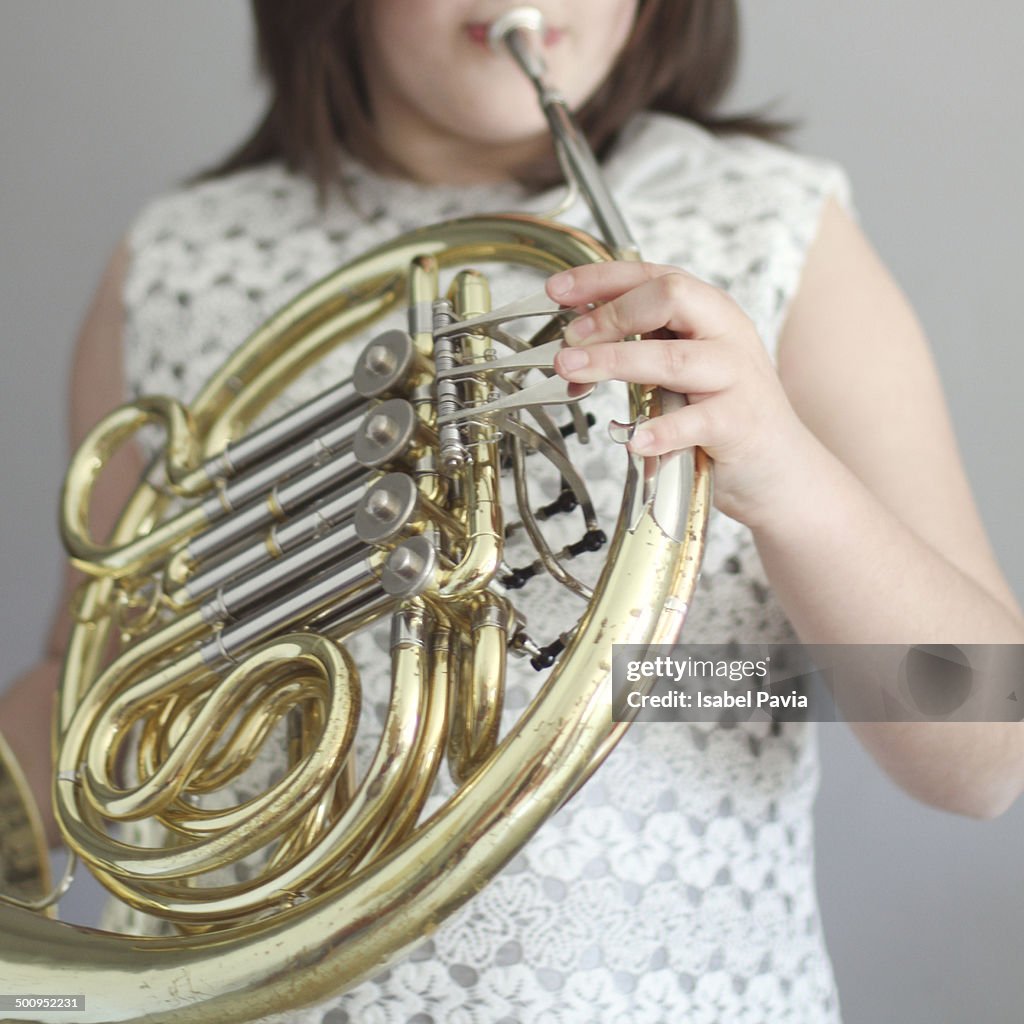 Girl playing French horn