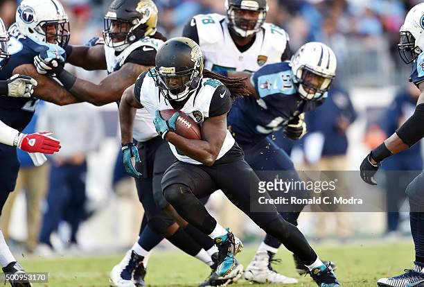Running back Denard Robinson of the Jacksonville Jaguars carries the ball during a NFL game against the Tennessee Titans at Nissan Stadium on...