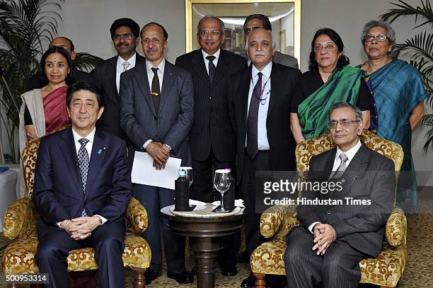 Jawaharlal Nehru University Vice Chancellor Sudhir Kumar Sopory with Japnese Prime Minister Shinzo Abe poses for a photo with JNU staff after...
