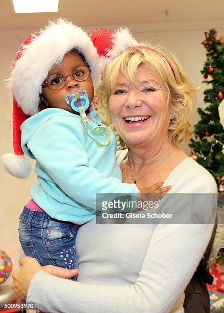 Jutta Speidel and Rachel pose during the Christmas party at Horizont e.V. On December 11, 2015 in Munich, Germany.
