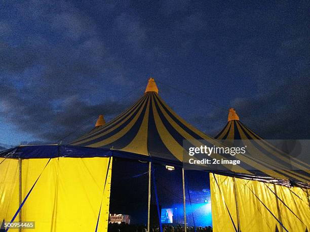 Tented festival stage at night