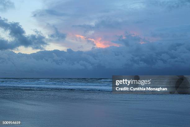 Pink sky peeks through heavy band of dark rain clouds in Daytona Beach Shores, Florida as Tropical Storm / Hurricane Arthur passes on July 2, 2014