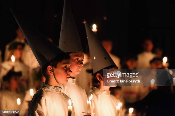 Young 'Starboys' from the Vaxholms boys choir sing during the traditional Swedish festival of Sankta Lucia in York Minster on December 11, 2015 in...