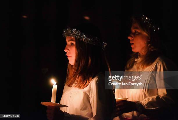 Members of the Chorus Pictor choir sing during the traditional Swedish festival of Sankta Lucia in York Minster on December 11, 2015 in York,...