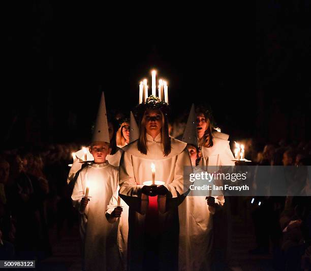 Sara Kjorling from Stockholm leads the procession during the traditional Swedish festival of Sankta Lucia on December 11, 2015 in York, England. The...