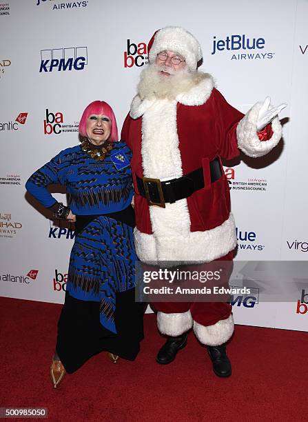 Designer Zandra Rhodes and Santa Claus arrive at the BABC LA 56th Annual Christmas Luncheon at the Fairmont Miramar Hotel on December 11, 2015 in...