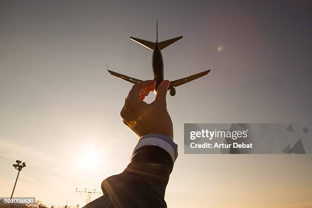 Grabbing airplane in the sky, playing with the perspective from personal point of view.