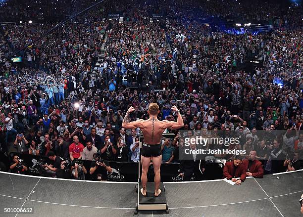 Interim featherweight champion Conor McGregor of Ireland weighs in during the UFC 194 weigh-in inside MGM Grand Garden Arena on December 10, 2015 in...