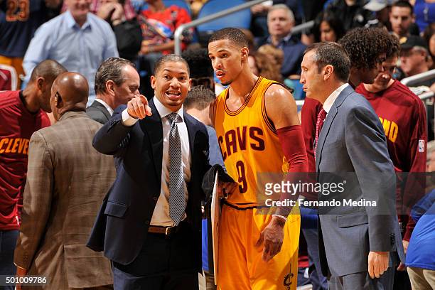 Jared Cunningham of the Cleveland Cavaliers speaks with coaches on the sidelines during the game against the Orlando Magic on December 11, 2015 at...