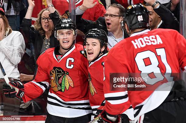 Jonathan Toews and Andrew Shaw of the Chicago Blackhawks celebrate after Toews scored against the Winnipeg Jets in the first period of the NHL game...