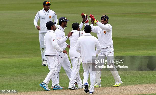 Rangana Herath of Sri Lanka celebrates taking the wicket of Martin Guptill of New Zealand during day three of the First Test match between New...