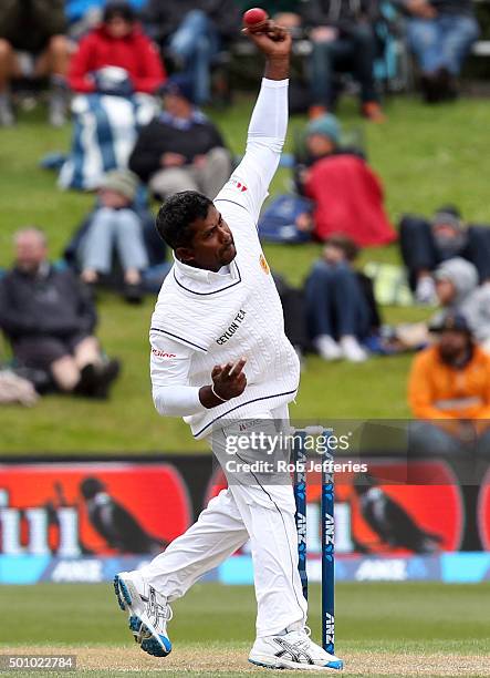 Rangana Herath of Sri Lanka bowls during day three of the First Test match between New Zealand and Sri Lanka at University Oval on December 12, 2015...