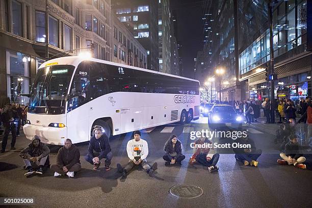 Demonstrators block a downtown intersection on December 11, 2015 in Chicago, Illinois. A recently released video showing the shooting of Laquan...