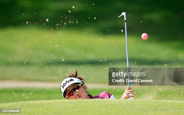 Thidapa Suwannapura of Thailand plays her third shot on the par 4, first hole during the final round of the 2015 Omega Dubai Ladies Masters on the...