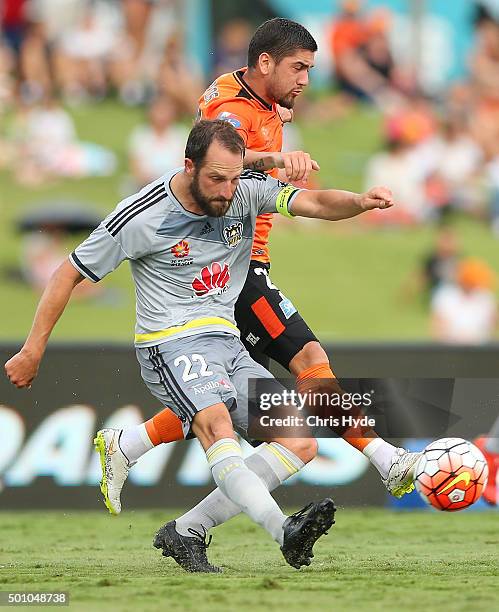 Andrew Durante of the Phoenix and Dimitri Petratos of the Roar compete for the ball during the round 10 A-League match between the Brisbane Roar and...