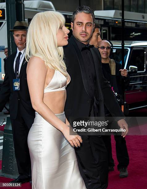 Singer-songwriter Lady Gaga and actor Taylor Kinney attend Billboard's 10th Annual Women In Music at Cipriani 42nd Street on December 11, 2015 in New...
