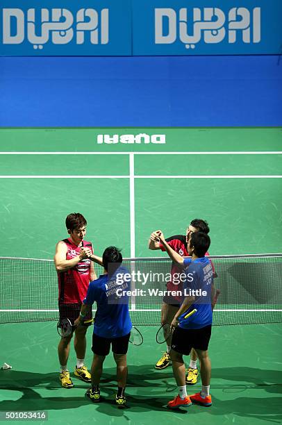 Yong Dae Lee and Yeon Seong Yoo of Korea shake hands with Mohammad Ahsan and Hendra Setiawan of Indonesia in the Men's Doubles semi final match...