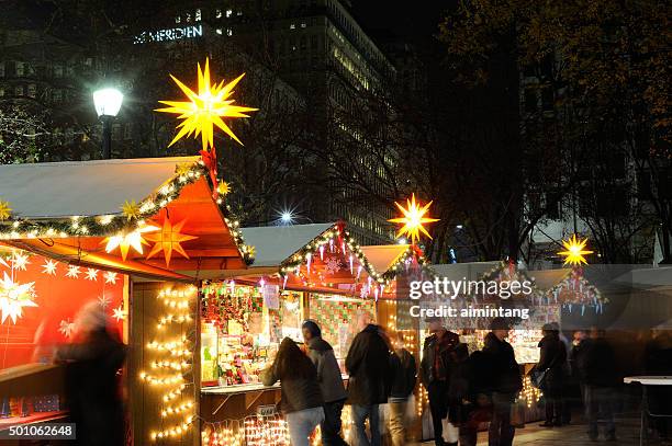 people at christmas village in philadelphia - john f kennedy plaza philadelphia stock pictures, royalty-free photos & images