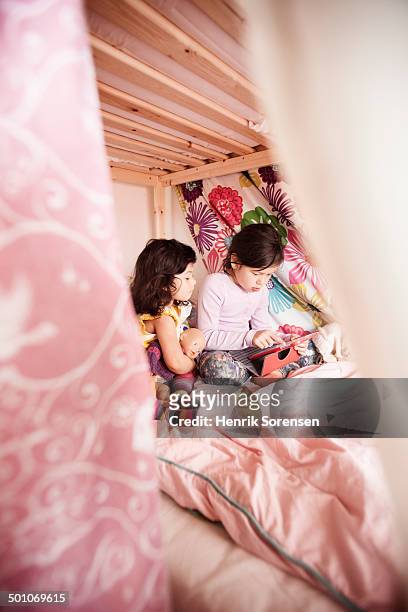 2 young girls playing behind blankets - bunk beds for 3 stock pictures, royalty-free photos & images