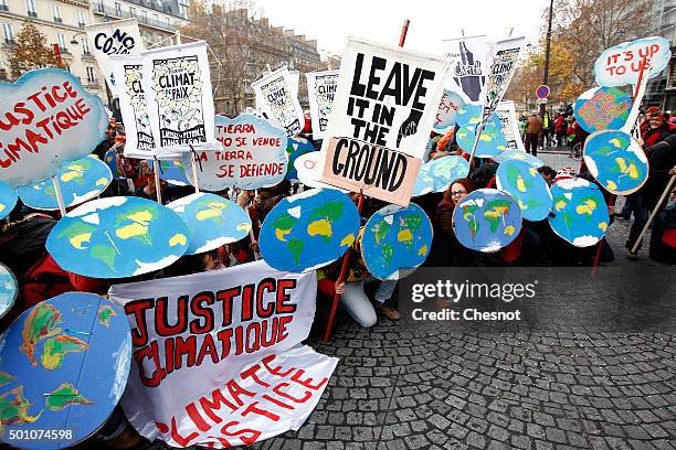 Environmentalists demonstrate during the World Climate Change Conference 2015 on December 12, 2015 in Paris, France. The first universal agreement on...