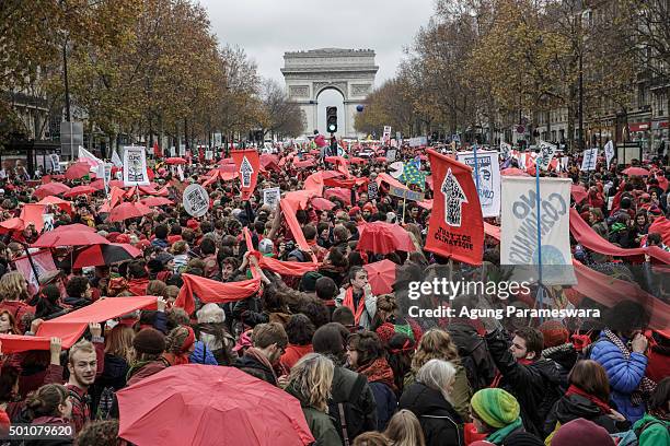 Thousands of activists gather during a demonstration near the Arc de Triomphe at the Avenue de la Grande Armee boulevard on December 12, 2015 in...