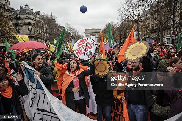 Activist shout during a demonstration near the Arc de Triomphe at the Avenue de la Grande Armee boulevard on December 12, 2015 in Paris, France. The...