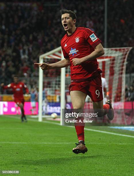 Robert Lewandowski of Bayern Muenchen celebrates his first goal during the Bundesliga match between FC Bayern Muenchen and FC Ingolstadt at Allianz...
