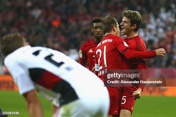 Philipp Lahm of Muenchen celebrates scoring the 2nd team goal with his team mate Thomas Mueller during the Bundesliga match between FC Bayern...