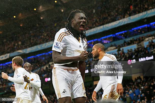 Bafetimbi Gomis of Swansea City celebrates scoring his team's first goal during the Barclays Premier League match between Manchester City and Swansea...