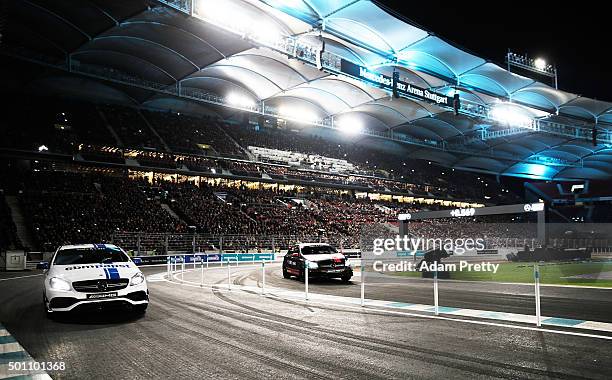 Lewis Hamilton of Great Britain races Mika Hakkinen of Finland in the first round of races in the Mecedes-AMG A 45 of the Stars and Cars event at...