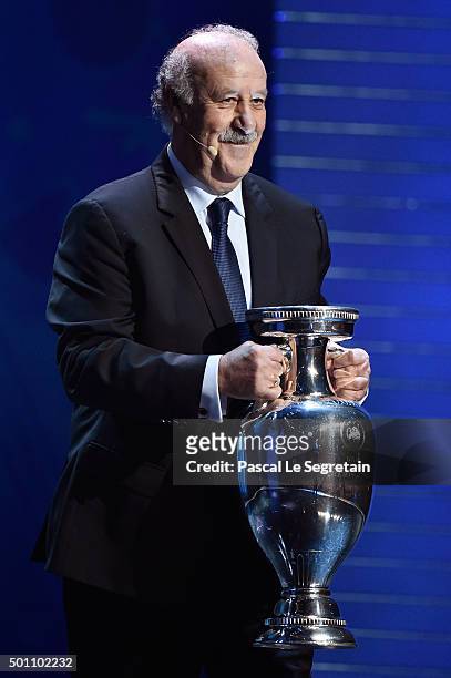Vicente del Bosque, Manager of Defending Champion Spain shows the European Championship Trophy during the UEFA Euro 2016 Final Draw Ceremony at...