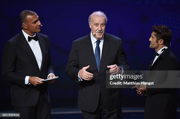 Vicente del Bosque Manager of Spain talks with host Ruud Gullit and Bixente Lizarazu on stage during the UEFA Euro 2016 Final Draw Ceremony at Palais...