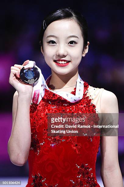 Marin Honda of Japan and bronze medal poses during the Junior Ladies medals ceremony during day three of the ISU Grand Prix of Figure Skating Final...