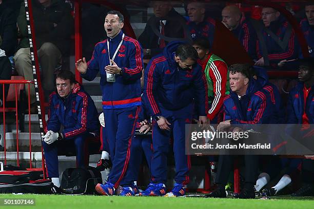 Assistant manager Ryan Giggs of Manchester Untied gestures while manager Louis van Gaal stays on the bench during the Barclays Premier League match...