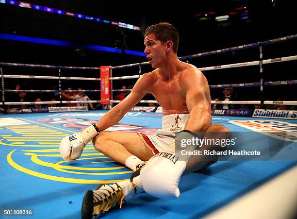 Luke Campbell sits on the canvas after being put down by Yvan Mendy in the WBC International Lightweight Championship fight during the Matchroom...