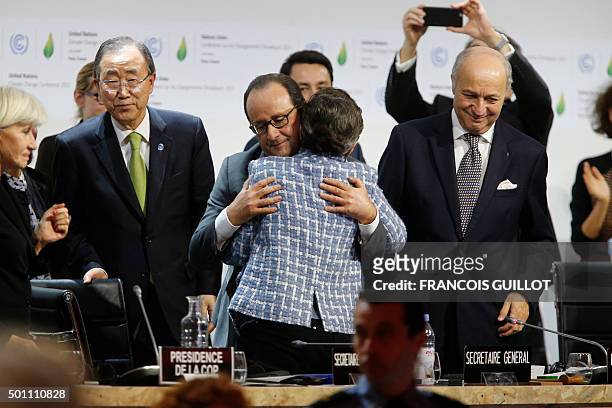 Executive Secretary of the United Nations Framework Convention on Climate Change Christiana Figueres and France's President Francois Hollande hug...