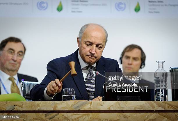 Foreign Affairs Minister and President-designate of COP21 Laurent Fabius is seen after adoption of a historic global warming pact at the COP21...