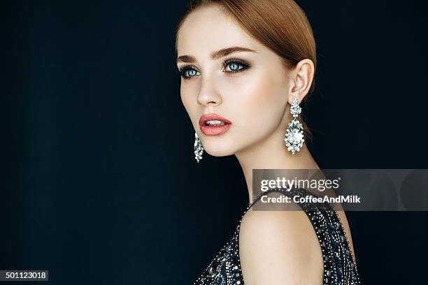 portrait of a nice looking woman with beautiful earings - örhänge bildbanksfoton och bilder