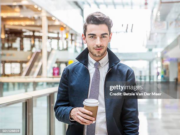 portrait of young man in indoor urban area. - hemd und krawatte stock-fotos und bilder