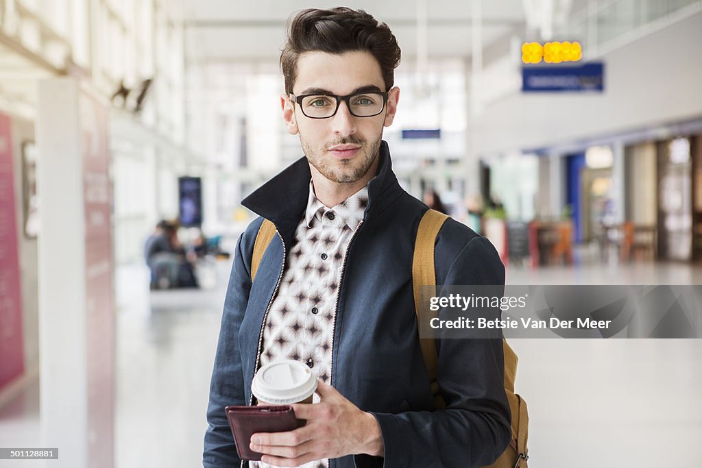 Young man waiting in station.