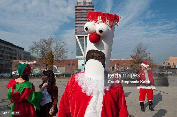 Man dressed as Beeker the Muppet as a Santa waits for the start of the annual SantaCon pub crawl December 12, 2015 in the Brooklyn borough of New...