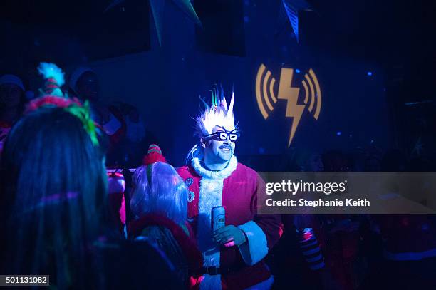 People dressed as a Santa drink beer at a club called Verboten during the annual SantaCon pub crawl December 12, 2015 in the Brooklyn borough of New...