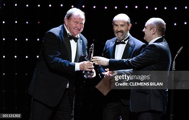 Spanish actors Carlos Areces and Javier Camara hand over European Comedy Award to the Swedish director Roy Andersson for his film "A Pigeon Sat On A...