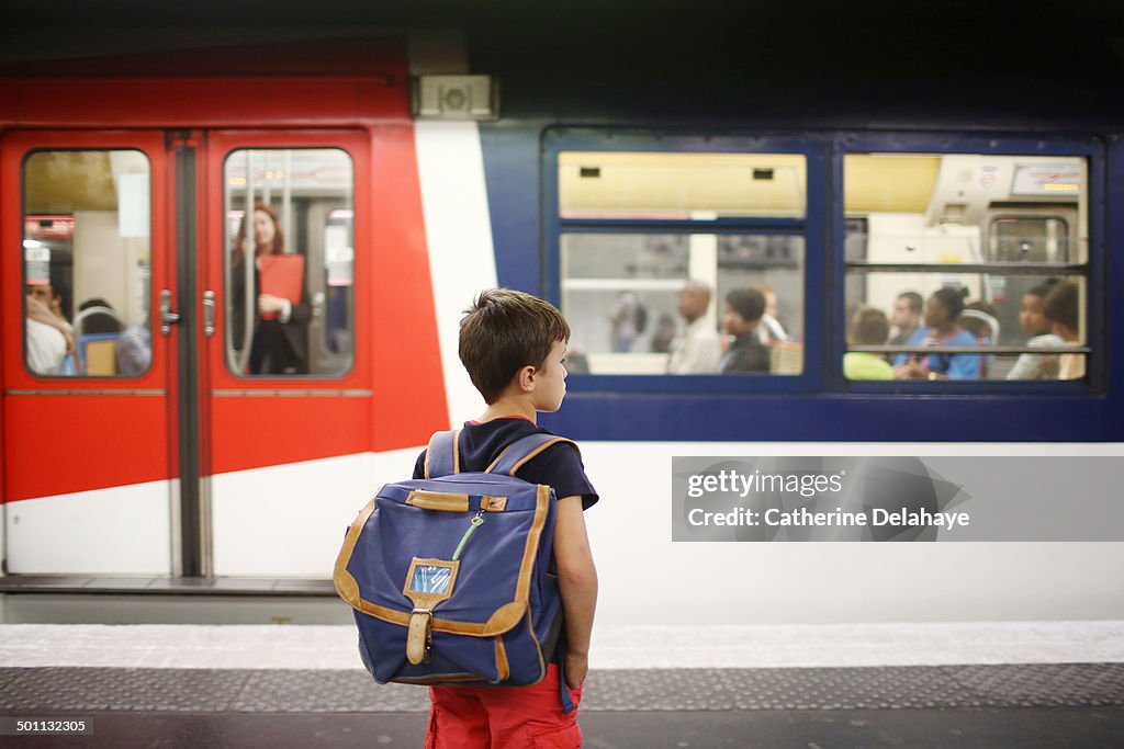 A 8 years old boy in public transport