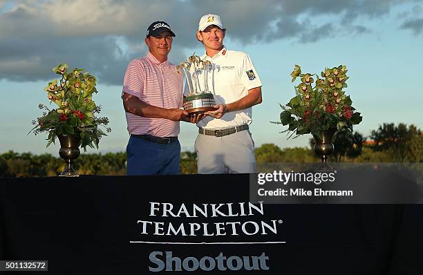 Jason Dufner and Brandt Snedeker pose with the trophy after winning the Franklin Templeton Shootout at Tiburon Golf Club on December 12, 2015 in...