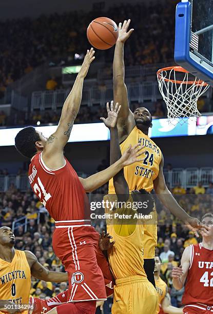 Forward Shaquille Morris of the Wichita State Shockers blocks the shot of forward Jordan Loveridge of the Utah Utes during the second half on...