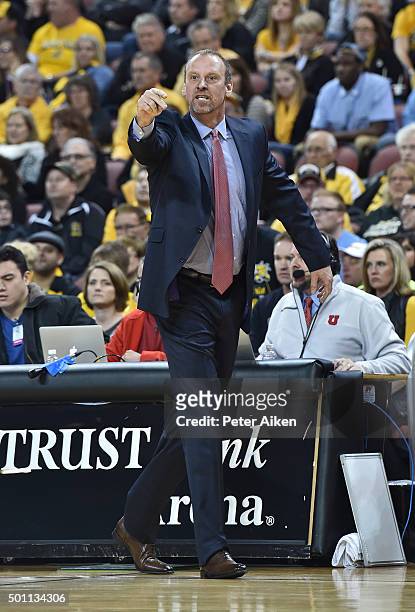 Head coach Larry Krystowiak of the Utah Utes calls out instructions against the Wichita State Shockers during the first half on December 12, 2015 at...