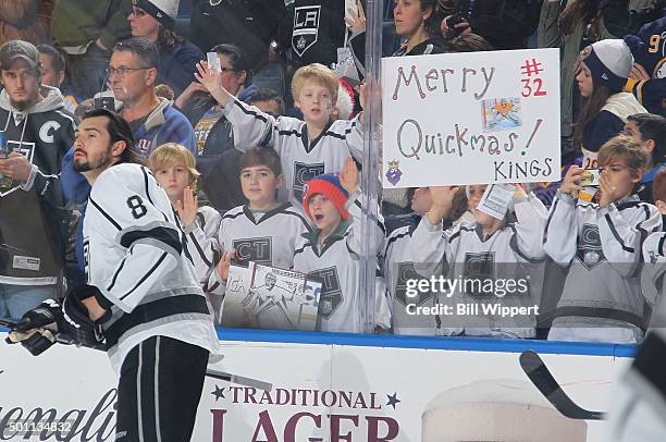 Young fans cheer as Drew Doughty of the Los Angeles Kings warms up before playing the Buffalo Sabres in an NHL game on December 12, 2015 at the First...