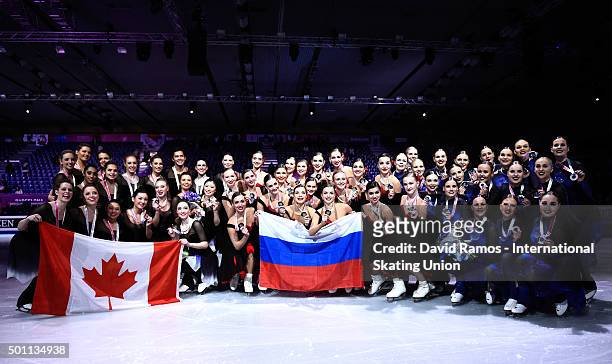 Team Rockettes of Finland and silver medal, Team Paradise of Russia and gold medal and Bronze medalists Team Nexxice of Canada pose during the...